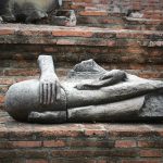 Buddha head in tree roots at Wat Mahathat, Ayutthaya