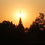 Buddha statue at sunset in Sukhothai, Thailand
