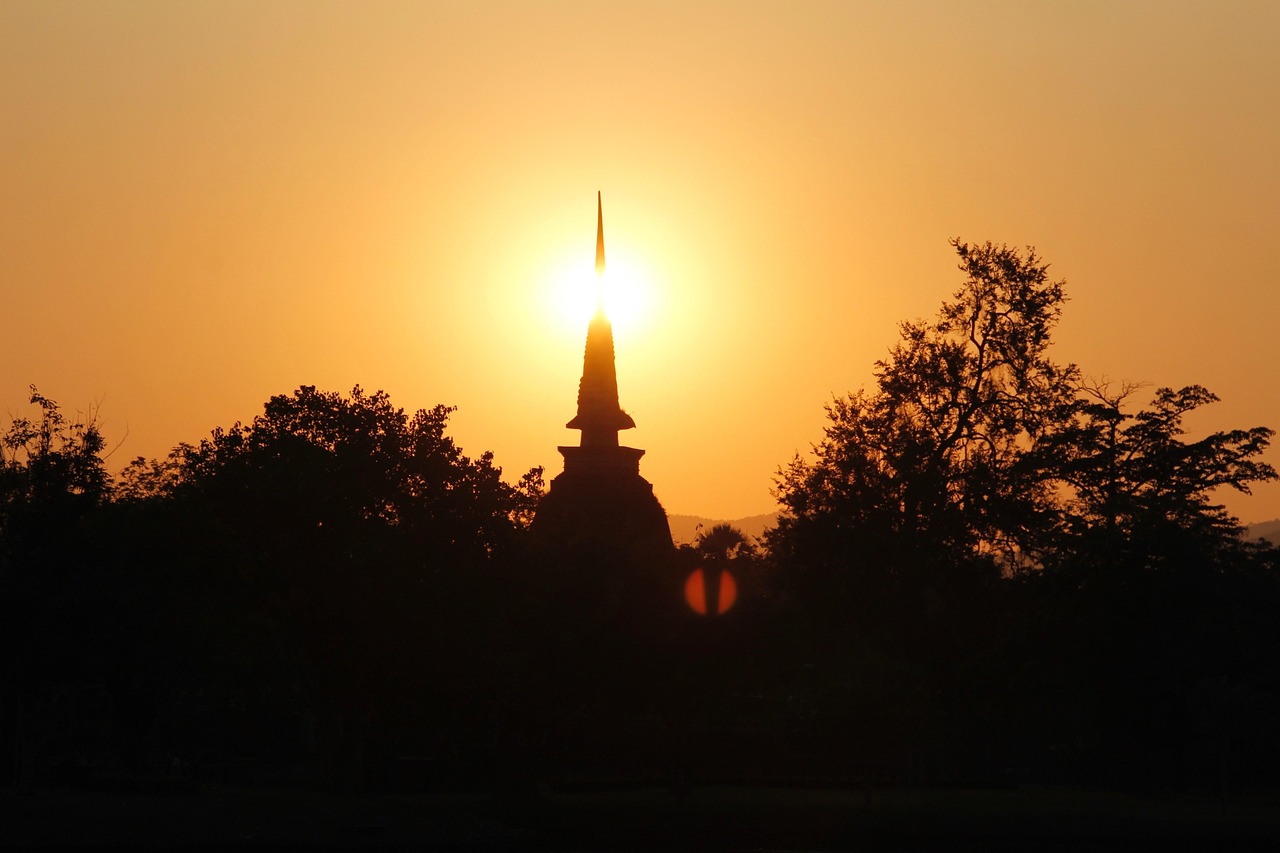 Buddha statue at sunset in Sukhothai, Thailand