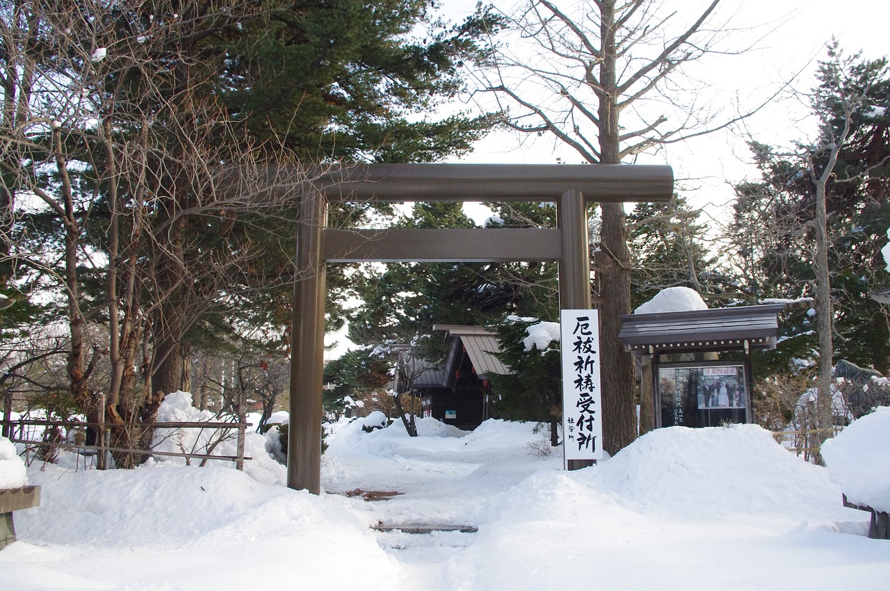 Torii gate and shrine grounds of Hokkaido Shrine in winter snow, Sapporo