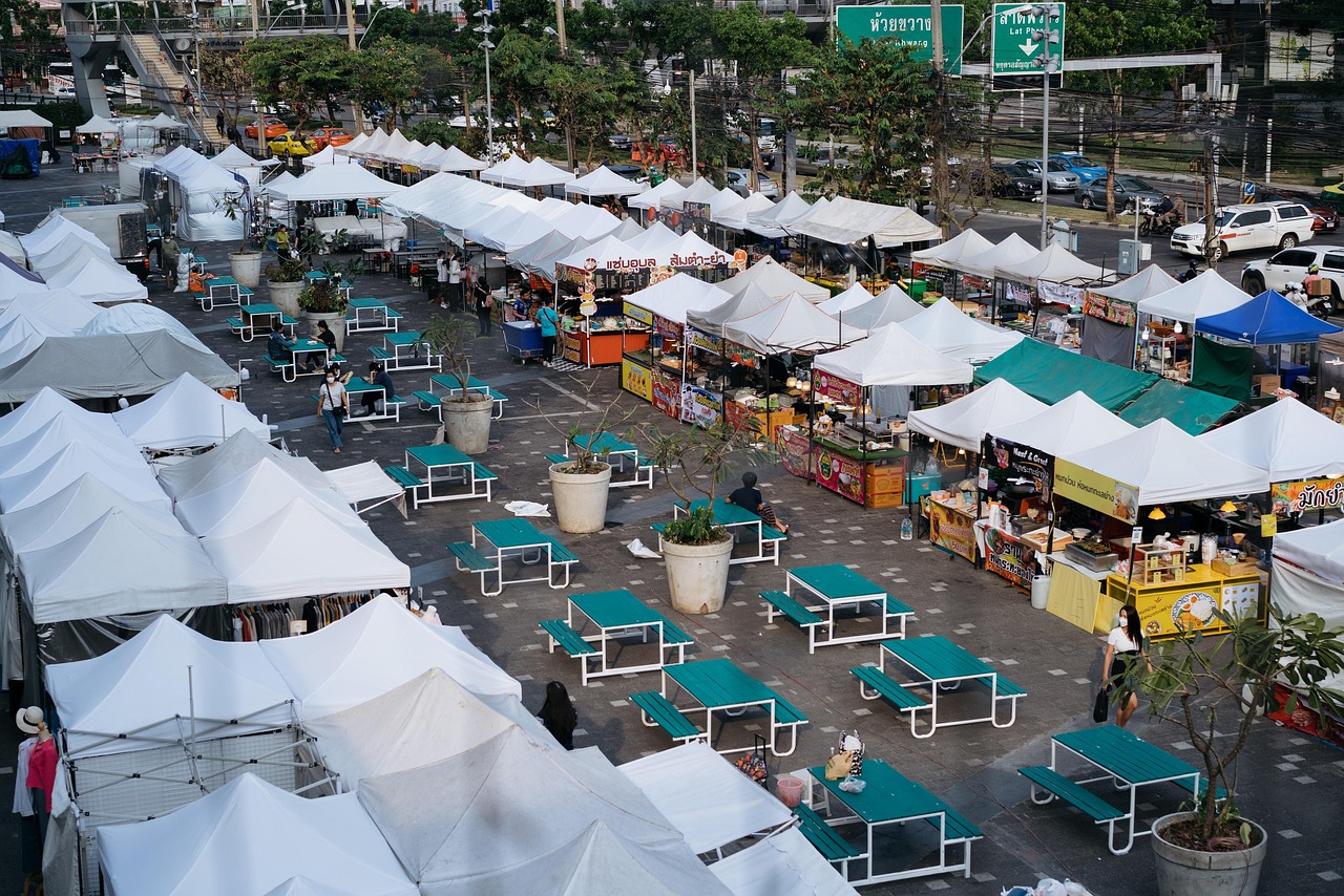 Vendors and shoppers at a busy Thai night market