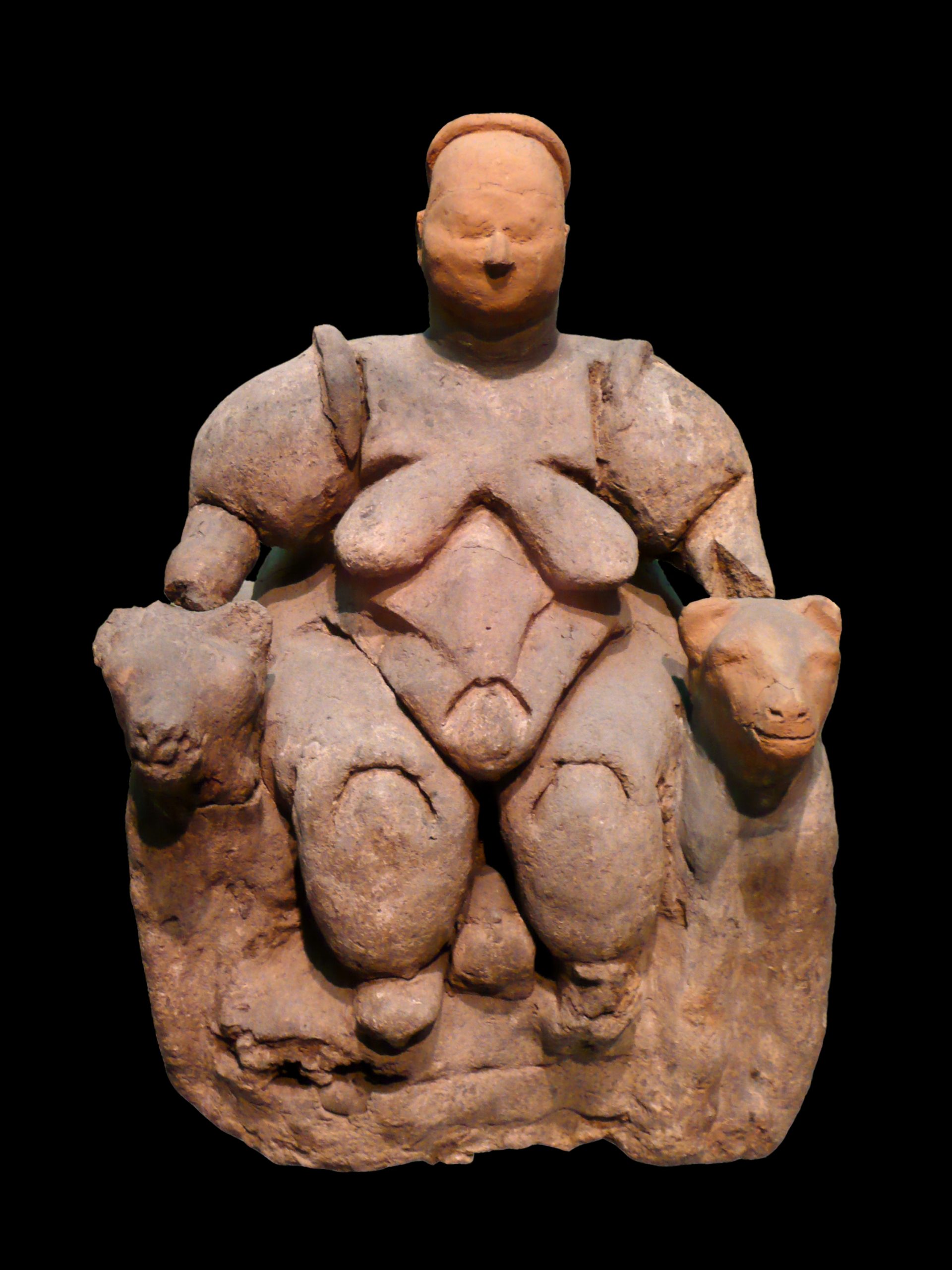 The famous seated figure from Çatalhöyük, often interpreted as a fertility or mother-goddess image, flanked by two felines. Photo: Wikimedia Commons