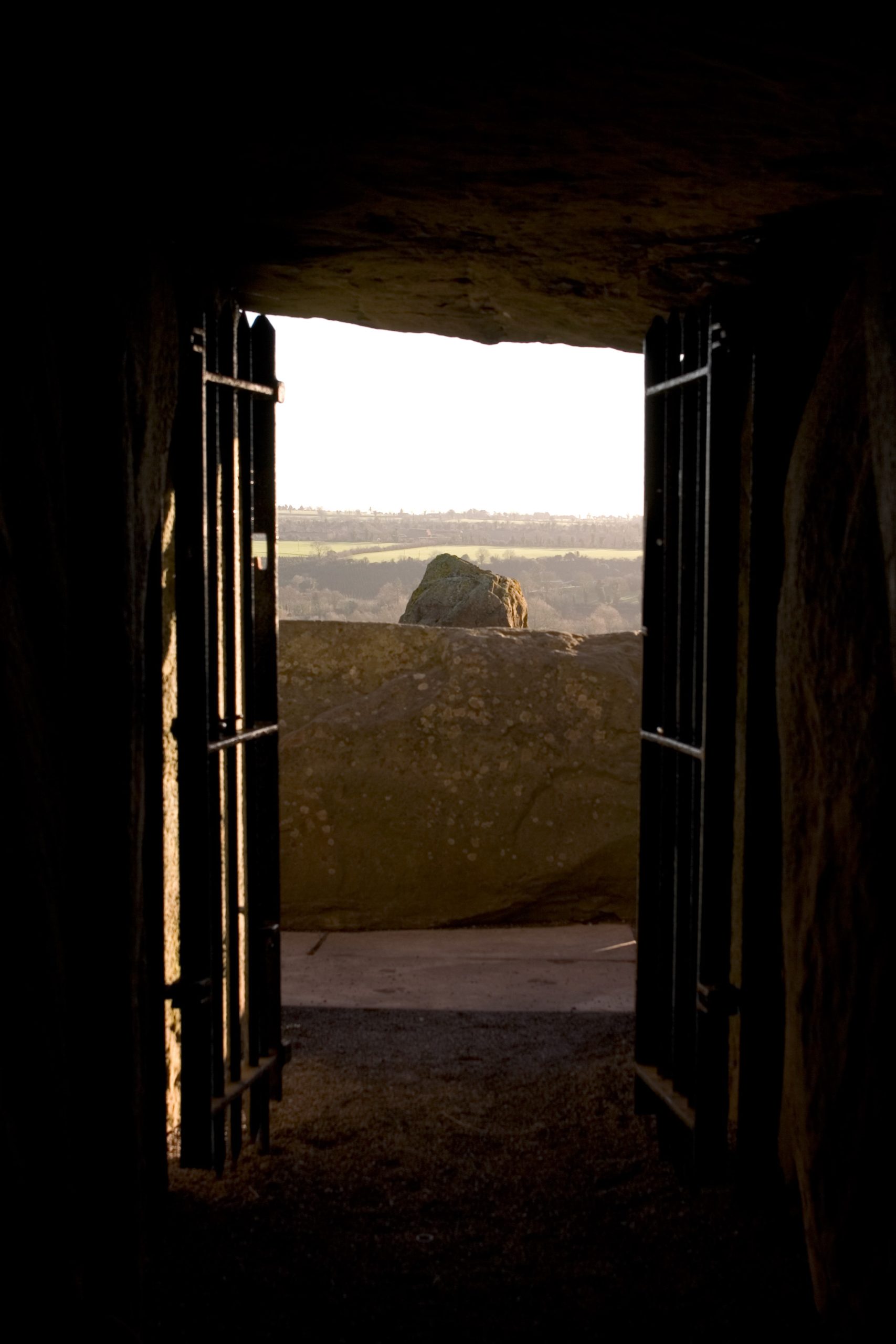 Looking out along the long stone passage of Newgrange toward the distant entrance. At the winter solstice, sunlight travels all the way down this passage. Photo: Wikimedia Commons