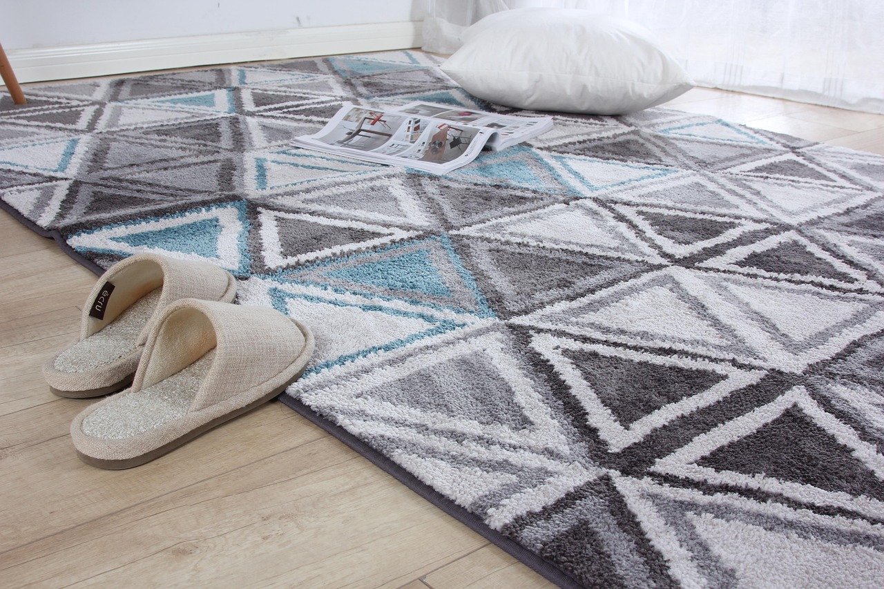 A woven carpet with geometric patterns of the kind central to Amazigh craft tradition