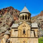 The medieval Noravank monastery set amid red cliffs in Armenia, a masterpiece of Armenian church architecture.
