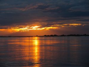 The broad waters of the Brahmaputra river flowing through Assam
