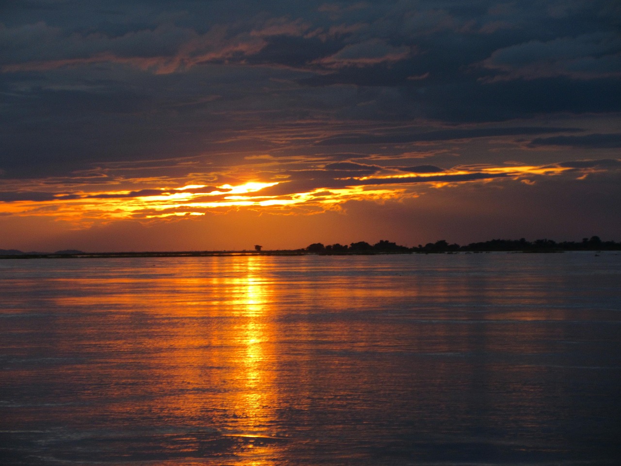 The broad waters of the Brahmaputra river flowing through Assam