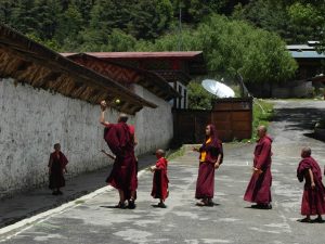 Young Buddhist monks of Bhutan in their crimson robes