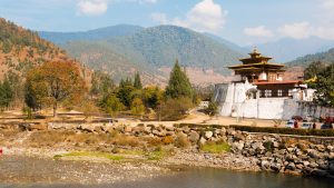 Traditional Bhutanese architecture with painted woodwork and pagoda roofs