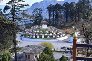 The chortens of Dochula Pass beneath the high Himalaya of Bhutan