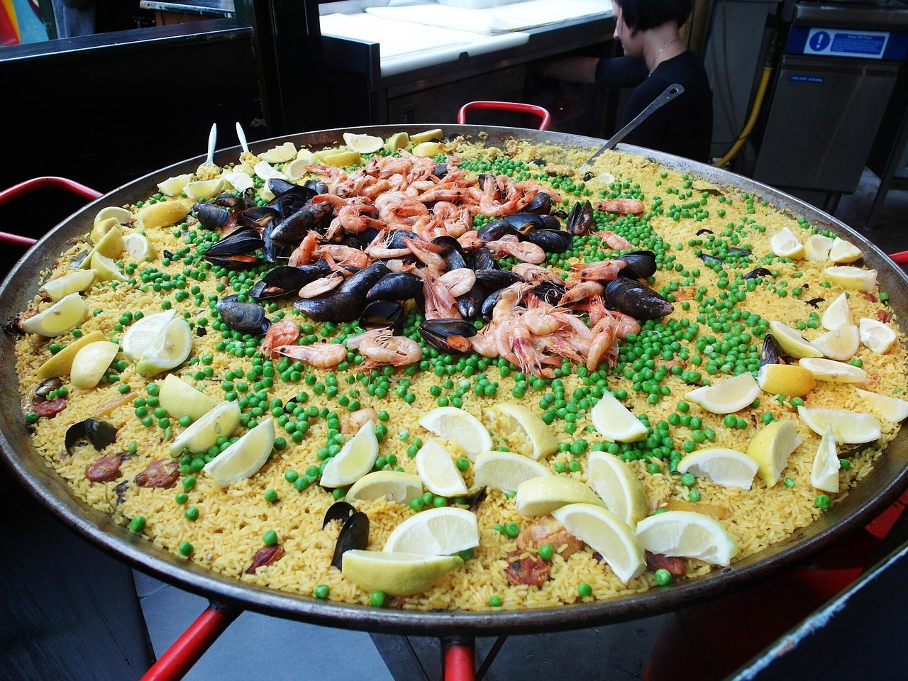 A huge pan of paella at a market food stall