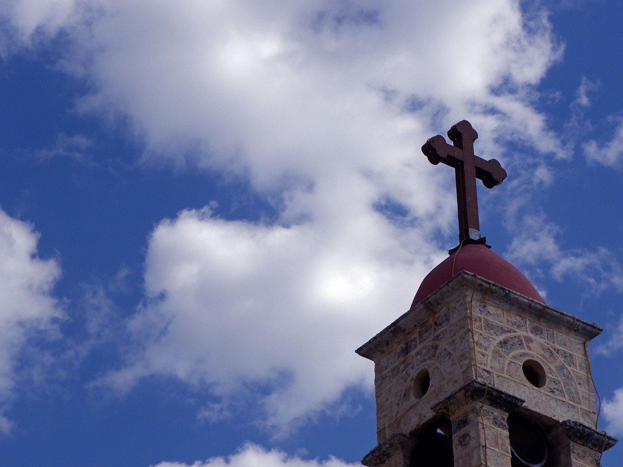 A church bell tower with a cross in Nazareth