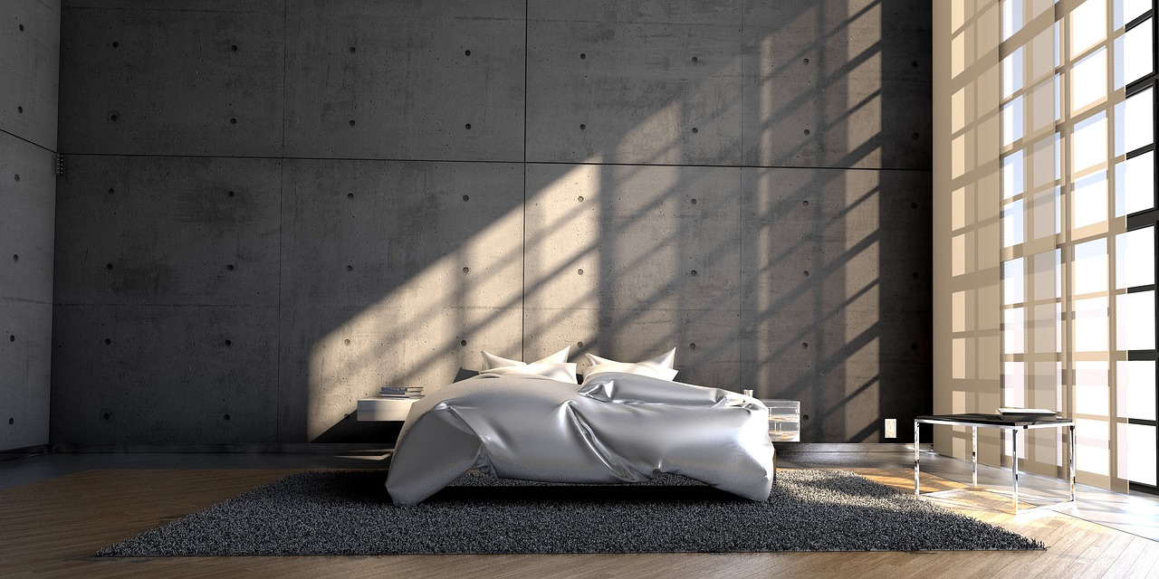 Soft throws and cushions adding warmth to a small bedroom
