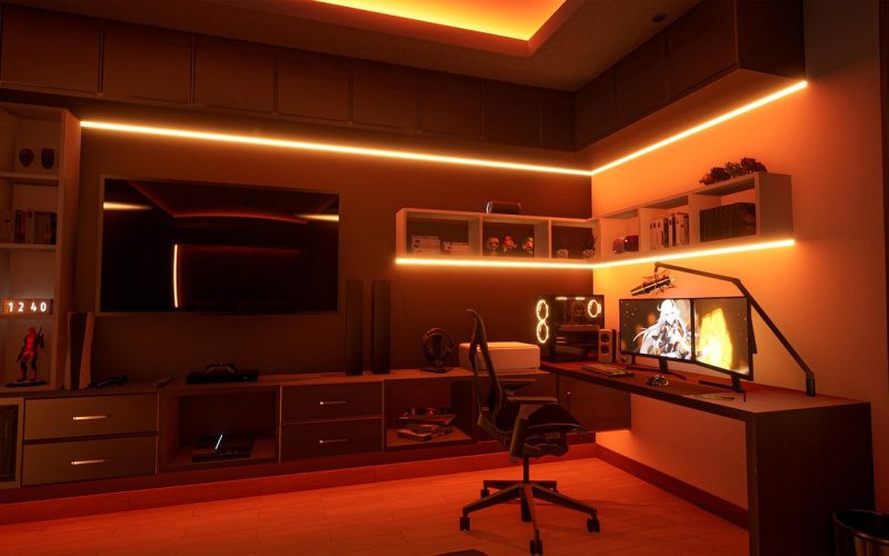 Developer home office with ambient lighting and screens