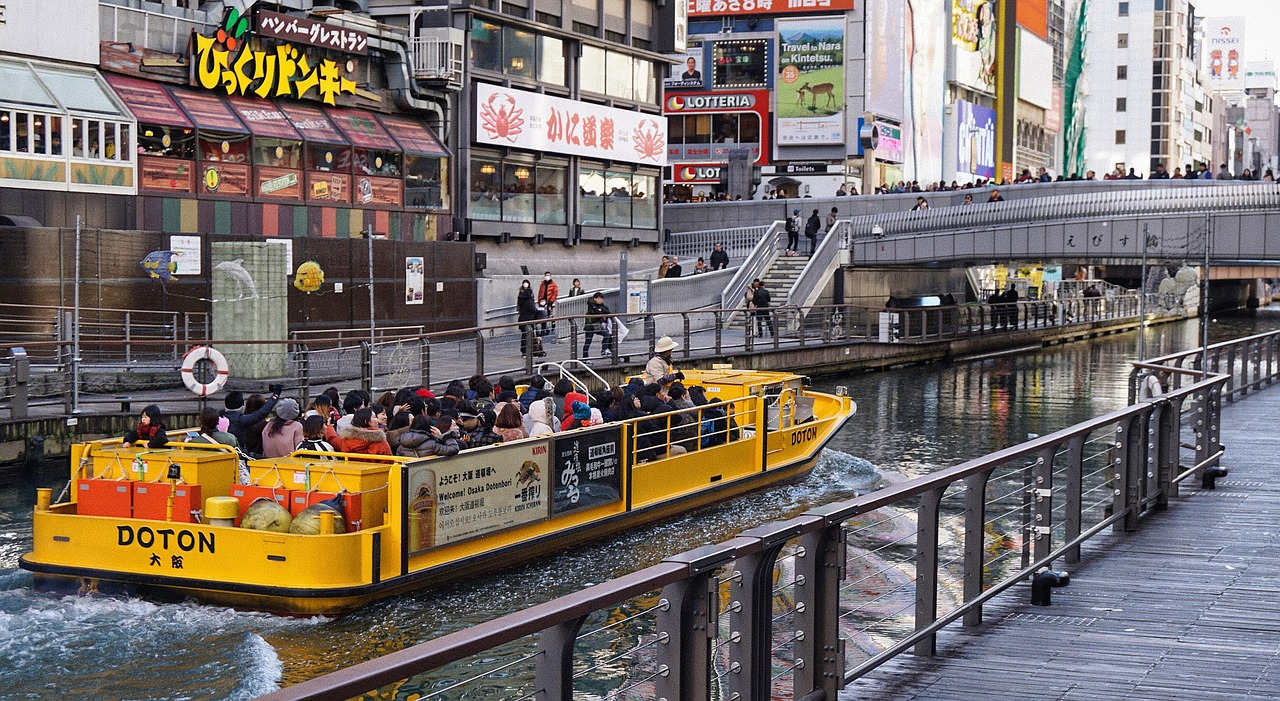 Neon signs reflected in the canal at Dotonbori, Osaka