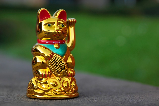 Rows of white beckoning cat statues