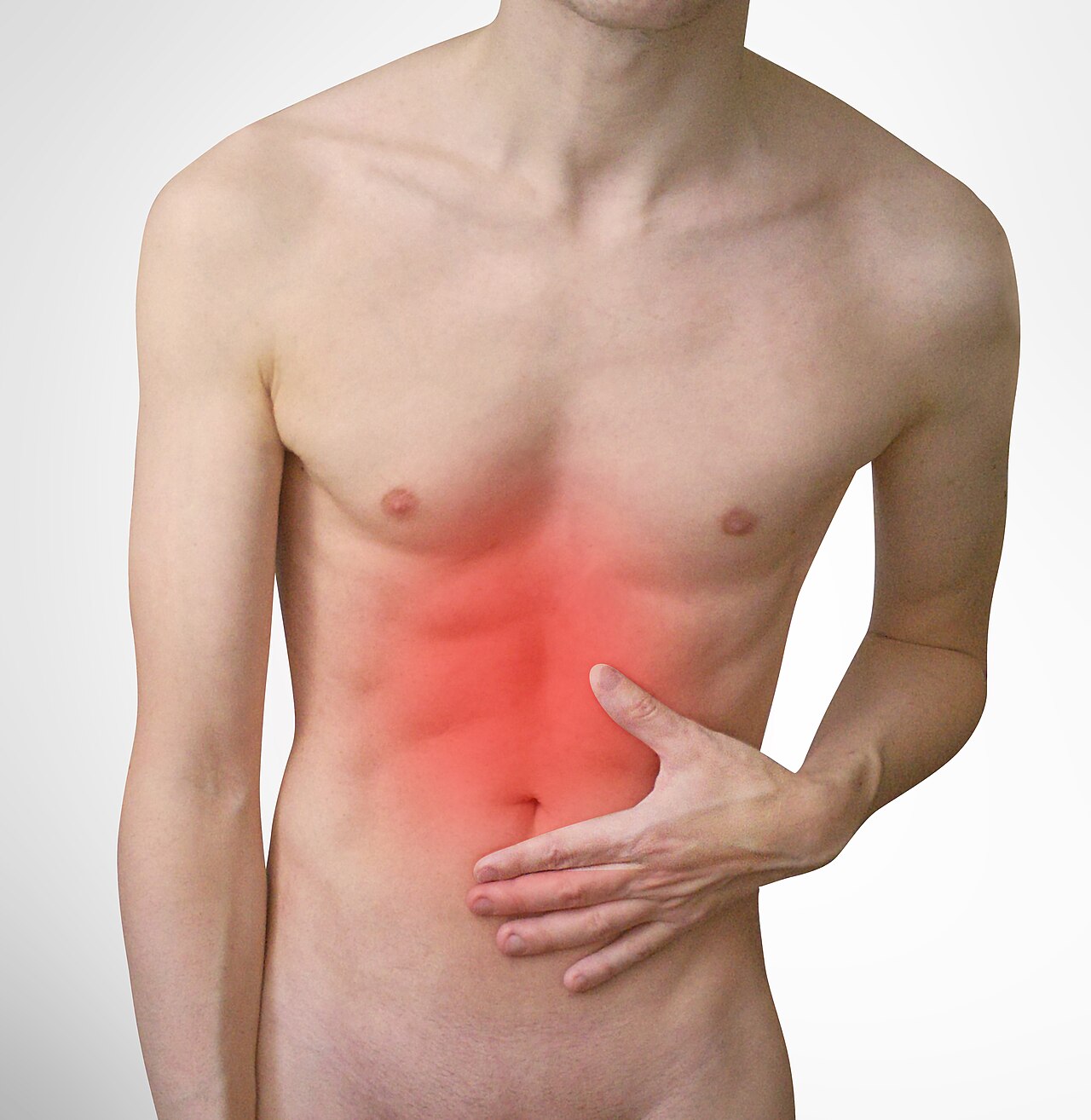 Person holding their abdomen in discomfort