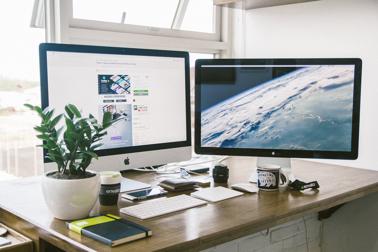 Dual-screen desktop setup on a developer desk