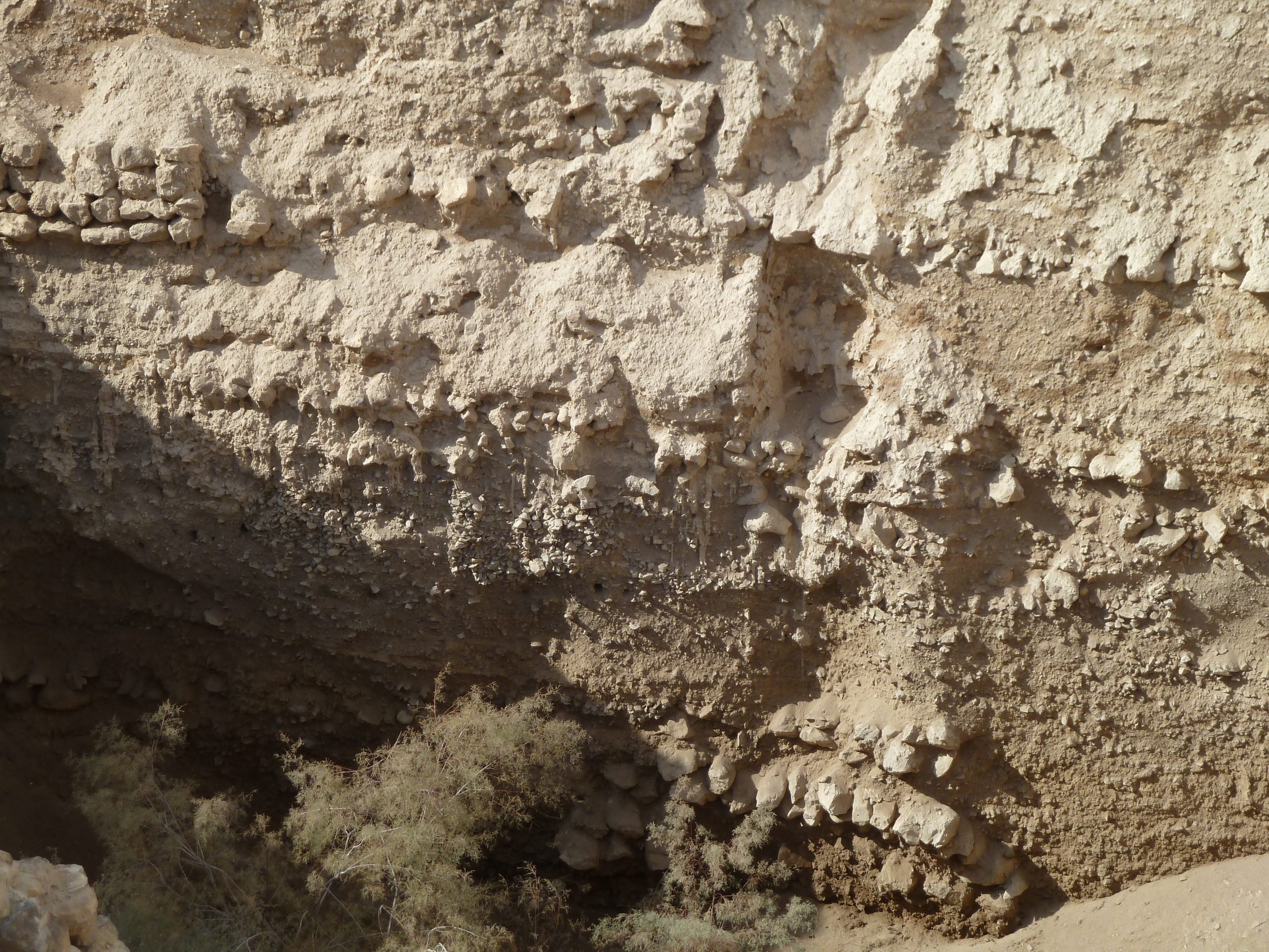 The exposed ancient walls and excavation areas of Tell es-Sultan, where thousands of years of building stack up in layers.