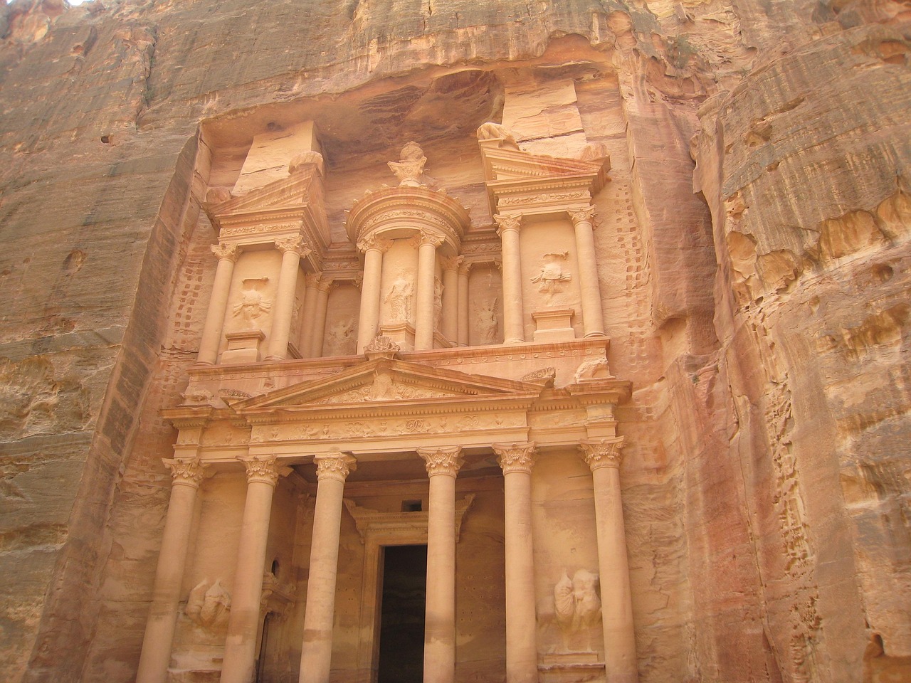 The carved facade of the Treasury at Petra, the rose red Nabataean city of Jordan