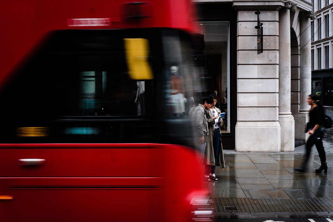 A red double-decker bus on a London street