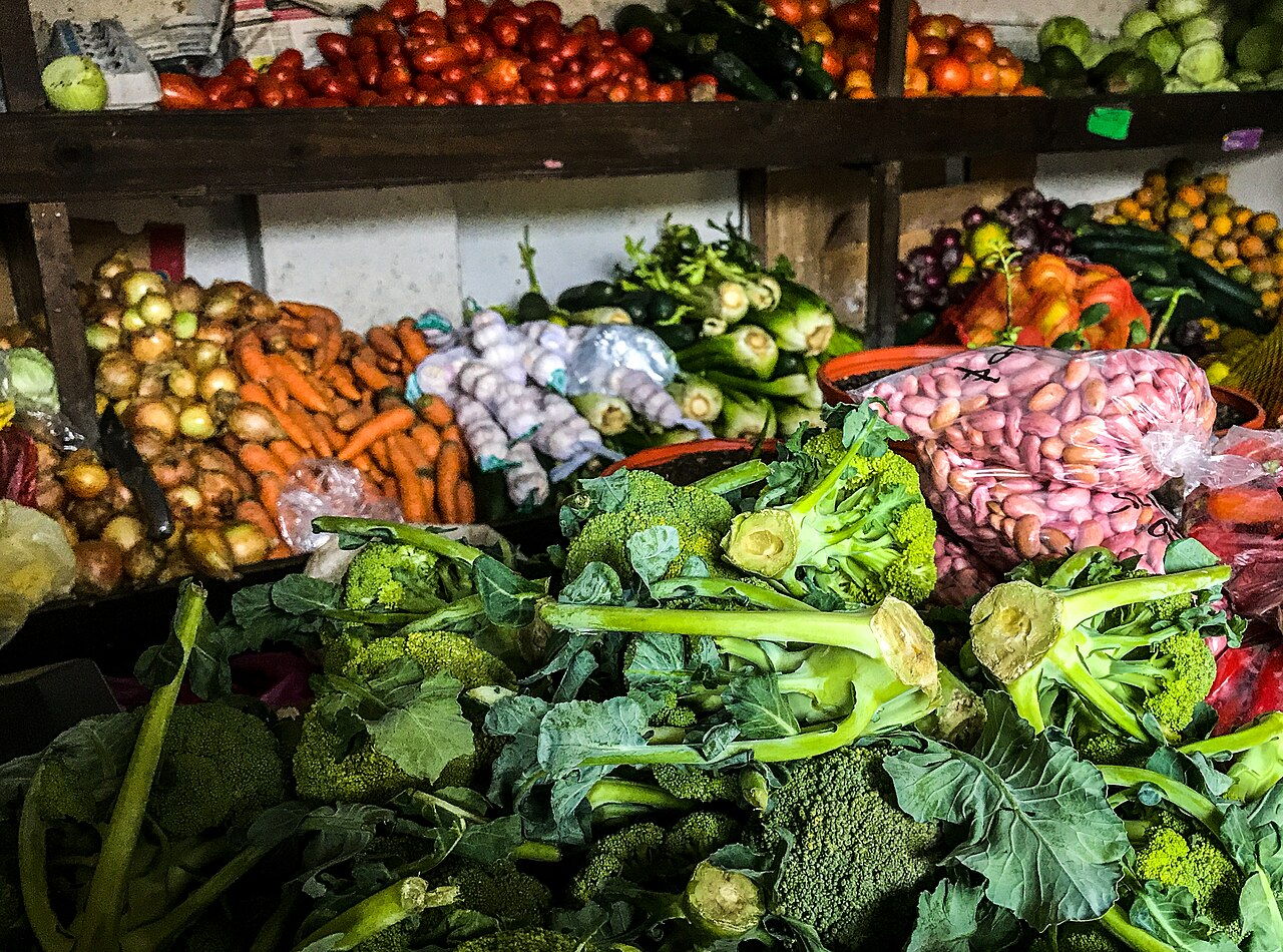 A colourful market stall of fresh vegetables and fruit