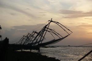 The Chinese fishing nets at Fort Kochi silhouetted against the sky