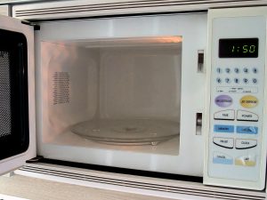 The interior of a microwave oven with its turntable