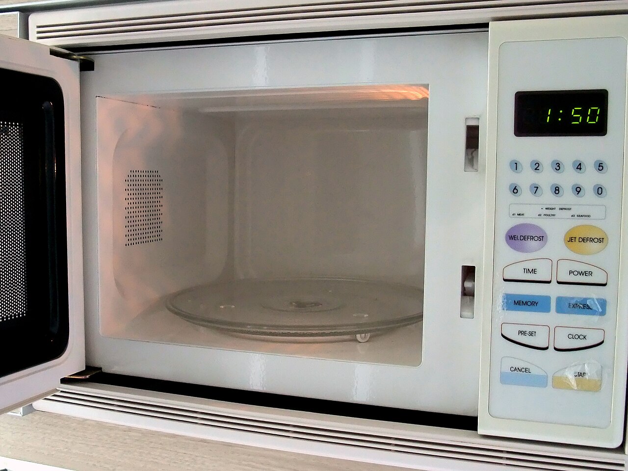 The interior of a microwave oven with its turntable