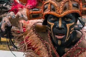 A face painted for ceremony, echoing the warrior traditions of the hills