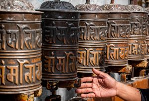 Prayer wheels turned by pilgrims, a constant of the Nepali sacred landscape