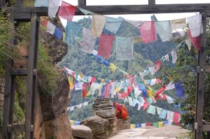 Prayer flags fluttering over a Bhutanese ridge