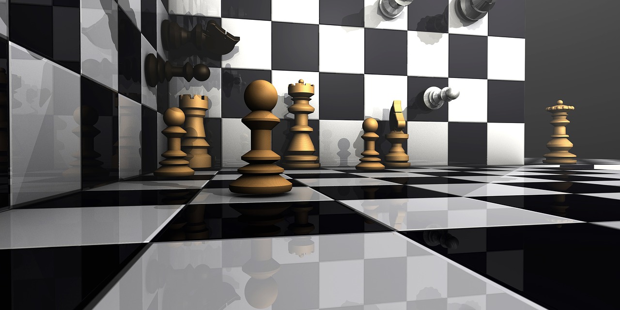 A chess king piece standing on a chessboard