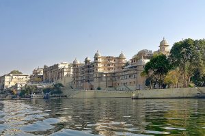 A palace reflected in the still waters of a lake at Udaipur