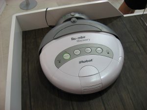 A robot vacuum returning to its charging dock