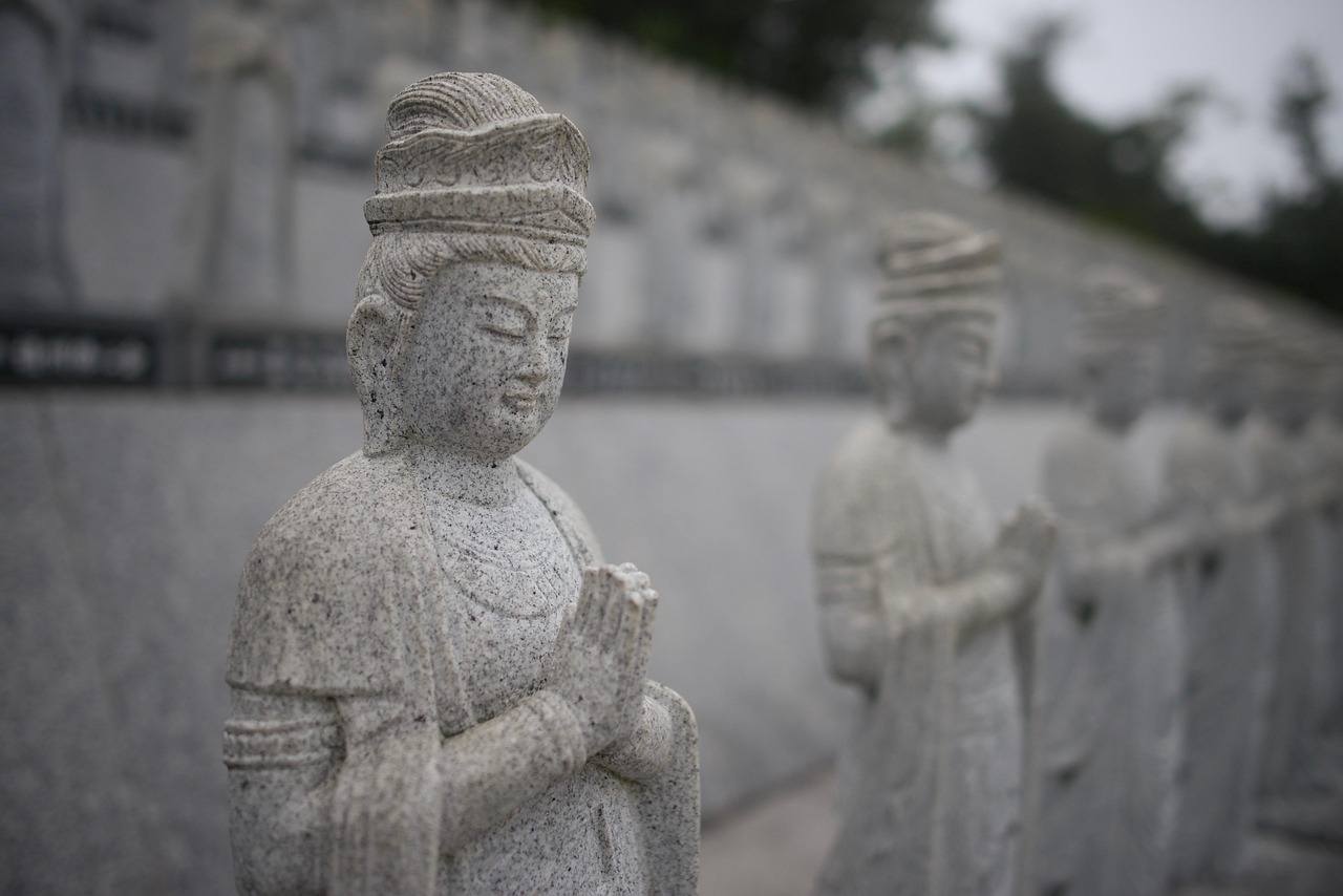 Rows of gilded Buddhist statues