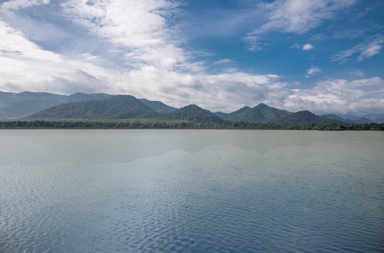 Forested hills reflected in a calm lake in the Eastern Ghats
