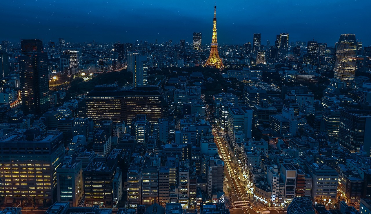 Tokyo Tower lit up against the city skyline