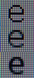 A close-up showing the red, green and blue sub-pixels of a screen
