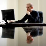 Developer using a triple-monitor coding setup