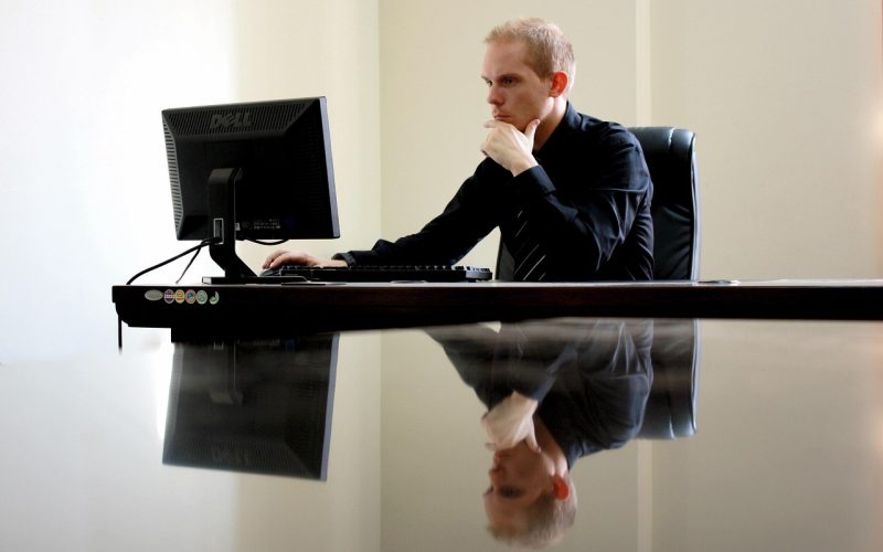 Developer using a triple-monitor coding setup