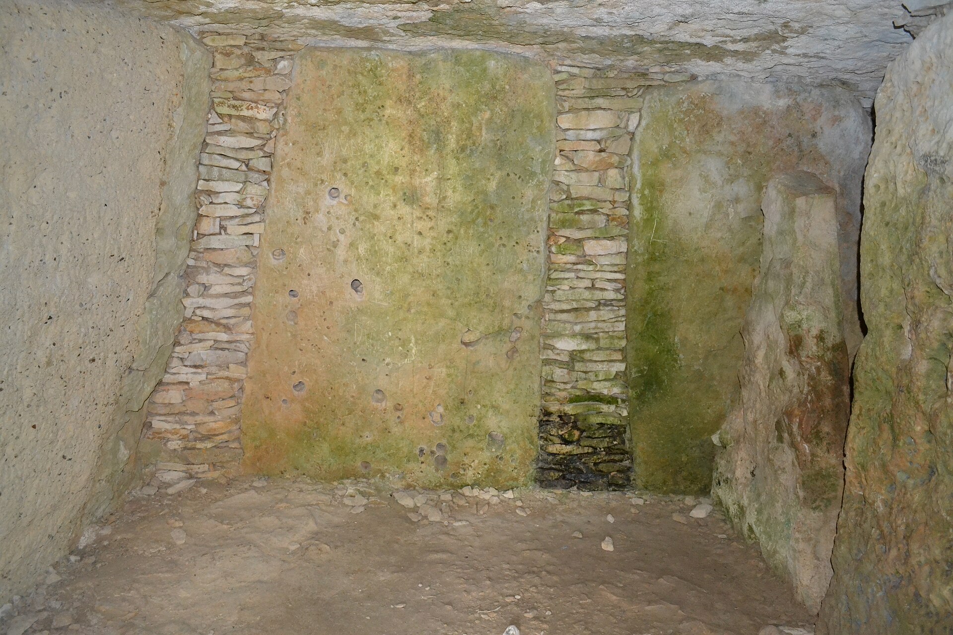 The long earthen tumulus at Bougon seen from the approach path