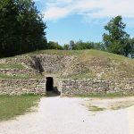 The stepped mound of Tumulus A rising from the Bougon necropolis