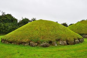 The vast grass-covered mound of Knowth seen up close