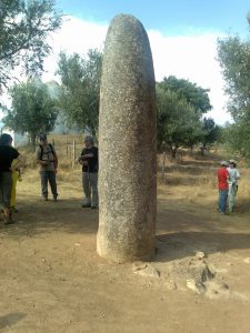 The lone Almendres menhir, a towering standing stone set slightly apart