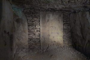 The slab-built stone burial chamber inside Tumulus A
