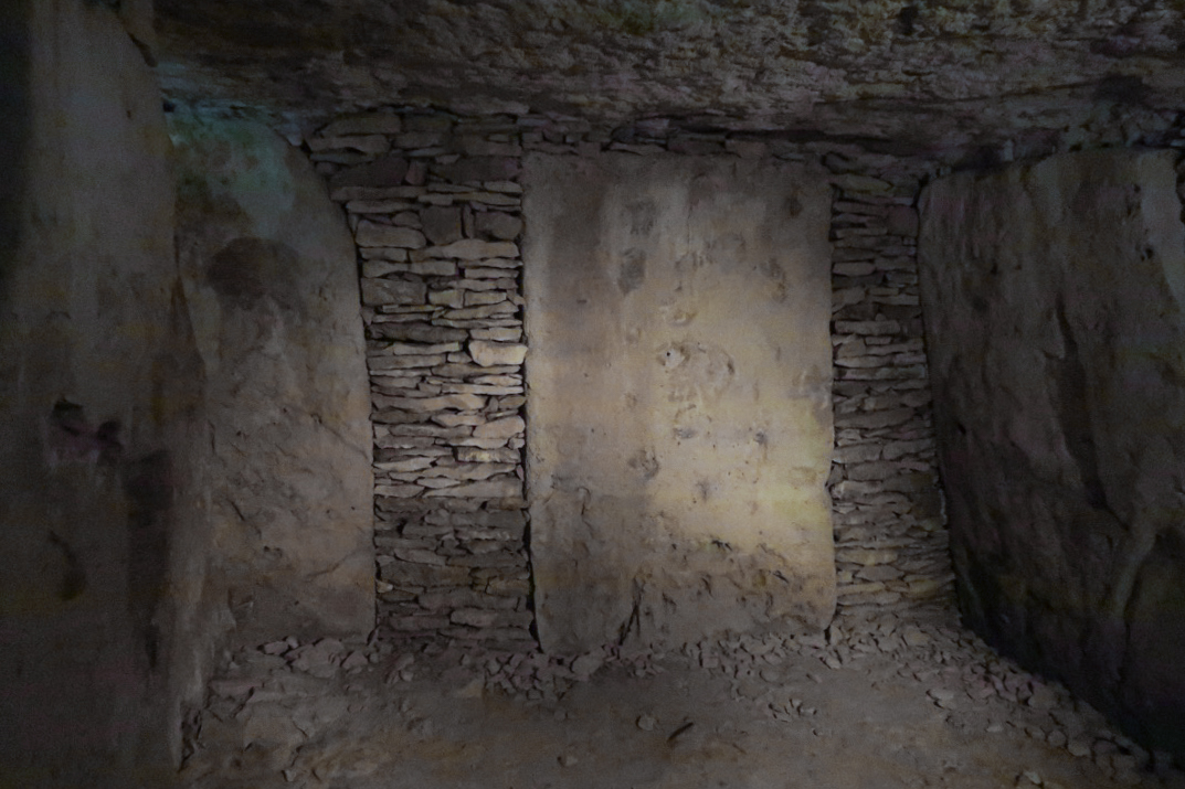 The slab-built stone burial chamber inside Tumulus A
