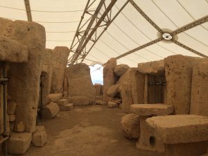 Weathered temple stones standing in the open air at Tarxien