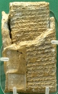 A cuneiform legal tablet still held in its clay case from the region