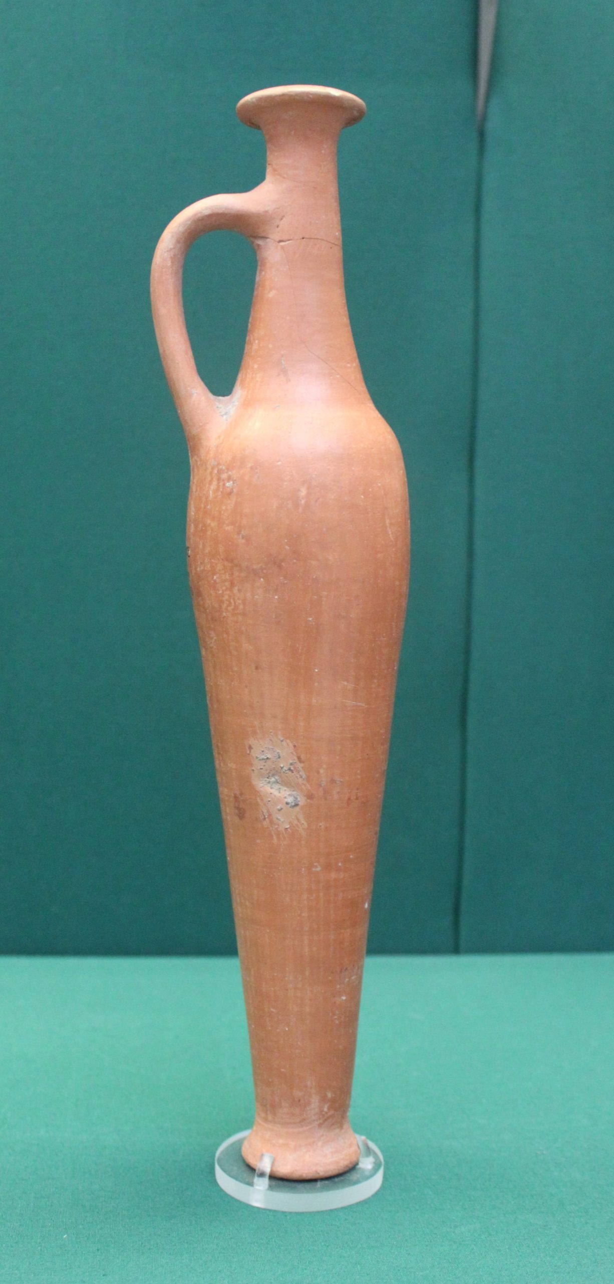 A red burnished flask from Alalakh in a museum collection